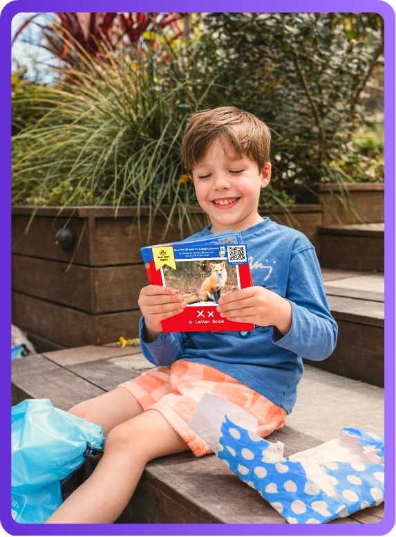 A parent and child working through a Just Right Reader book together at a kitchen table.