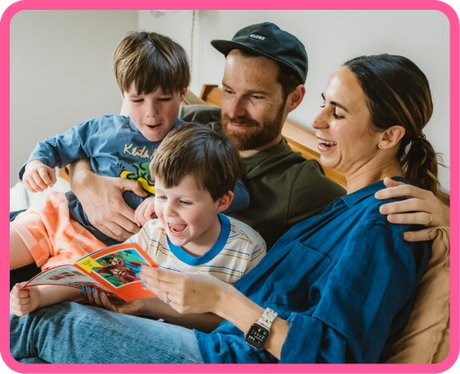 A parent and child reading a Just Right Reader book together at home.