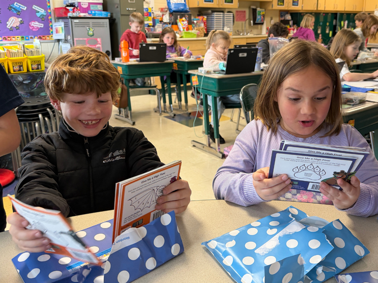 Students holding up their Just Right Reader books